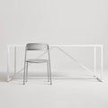 Trim Chair by Blu Dot in Silver perforated powder-coated steel, front view with Strut dining table