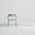 Trim Armchair by Blu Dot in Grey Blue perforated powder-coated steel, front view with Strut dining table