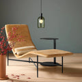 Blu Dot Bub Pendant Light in olive glass styled above a camel velvet chaise lounge in a moody modern living room