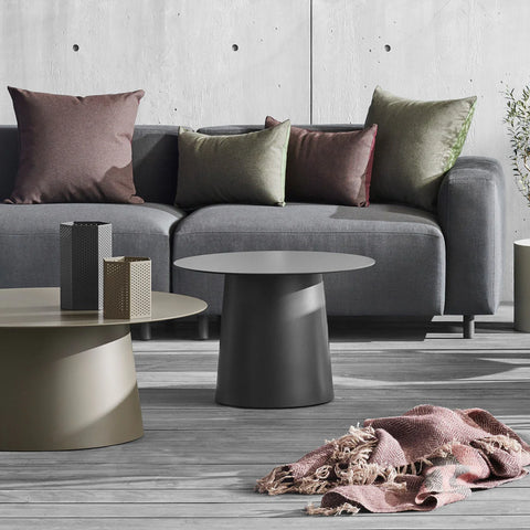 Blu Dot Circula Low Side Table in oblivion and putty styled on an outdoor deck with a grey sofa