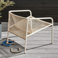 Lookout Outdoor Lounge Chair by Blu Dot in natural all-weather rope and white powder-coated aluminum, styled on outdoor deck