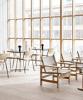 danish modern inspired institutional space featuring borge mogensen chairs