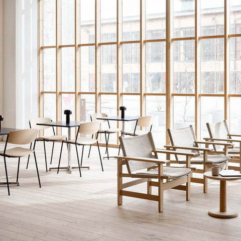 danish modern inspired institutional space featuring borge mogensen chairs