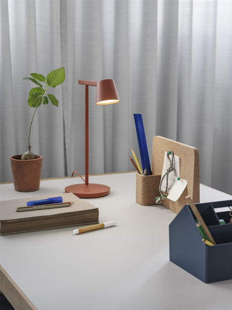 Modern office workspace with Story Pinboard by Muuto, featuring minimalist design and creative organization.