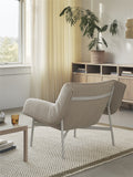 wrap lounge chair by muuto in a scandinavian inspired living room